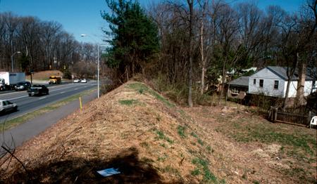 Berm Shielding Home from Road Traffic